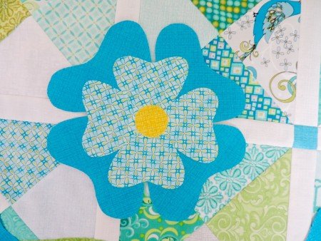 flower from blue and green quilt