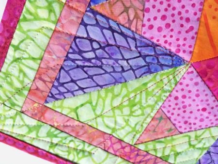 Island Batik paper piecing Project featured by top US quilting blog and shop, Seams Like a Dream Quilt Designs