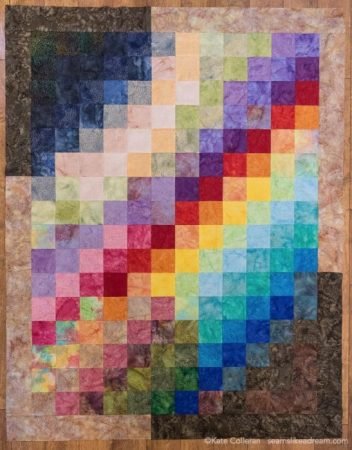 Island Batik Four Seasons Quilt Pattern featured by top US quilting blog and shop, Seams Like a Dream Quilt Designs: Batik quilt with borders on