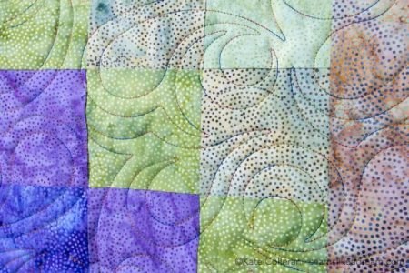 Island Batik Four Seasons Quilt Pattern featured by top US quilting blog and shop, Seams Like a Dream Quilt Designs: swirly quilting design