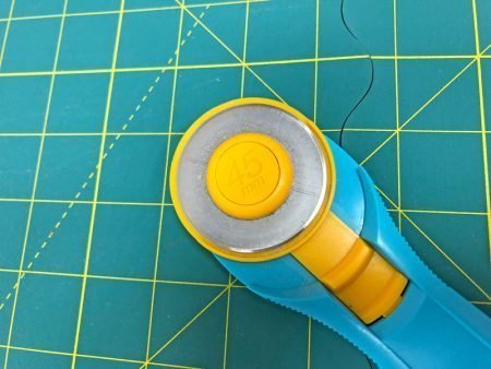 Exploring Quilting Basics: 4 Fabric Cutting Prep Tips featured by top US sewing and quilting blog, Kate Colleran Designs: rotary cutter