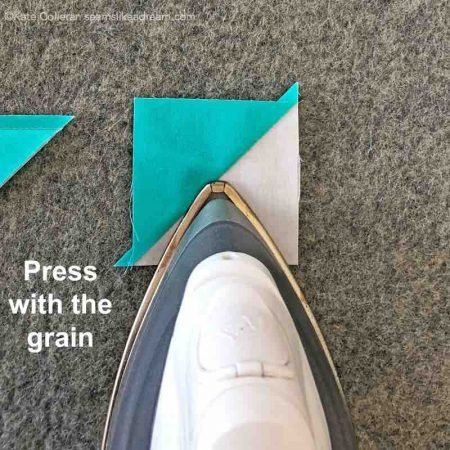 5 Tips for Pressing Quilt Seams featured by top quilting and sewing shop, Seams Like a Dream Quilt designs, explains why pressing with the grain of the fabric matters when you quilt.