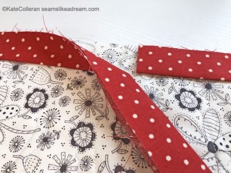 Exploring Quilting Basics: Binding a Quilt, featured by top quilting blog, Seams Like a Dream Quilt Designs, explains some best practices when binding a quilt.