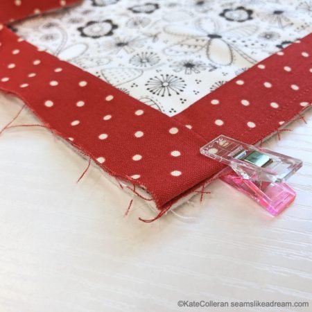 Exploring Quilting Basics: Binding a Quilt, featured by top quilting blog, Seams Like a Dream Quilt Designs, explains some best practices when binding a quilt.