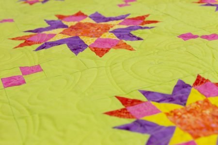 Top US quilting blog and shop, Seams Like a Dream Quilt Designs, shares her new star quilt Astria! 