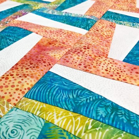 Top US quilting blog and shop, Seams Like a Dream Quilt Designs, shares about a re-imagined Rail Fence quilt!