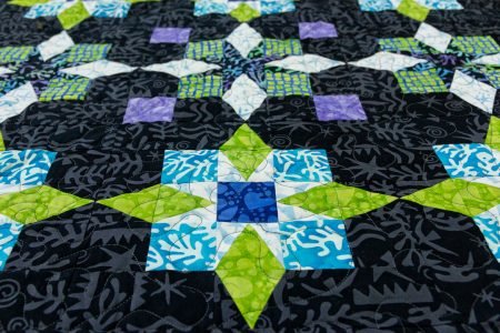 Top US quilting blog and shop, Kate Colleran Designs, shares about a new batik line, Moonlight Sky and new quilt patterns!