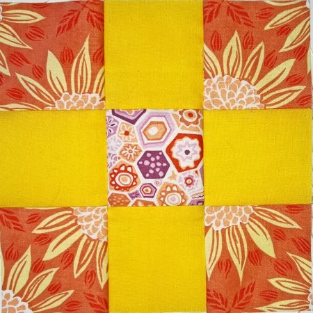 Top US quilting blog and shop, Kate Colleran Designs, shares about her nine patch block including an orange and yellow block with sunflowers!