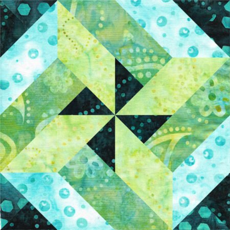 Top US quilting blog and shop, Kate Colleran Designs, shares about her plans for 2024! Quilt block image is a pinwheel block in dark blue, light blue and medium and light green.