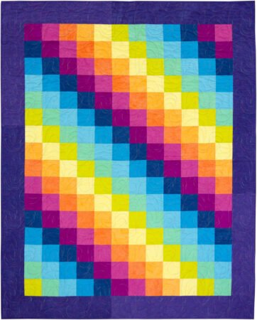 Top US quilting blog and shop, Kate Colleran Designs, shares about new quilts in the new year! Featured quilt is squares in a rainbow of solid colors with deep purple borders