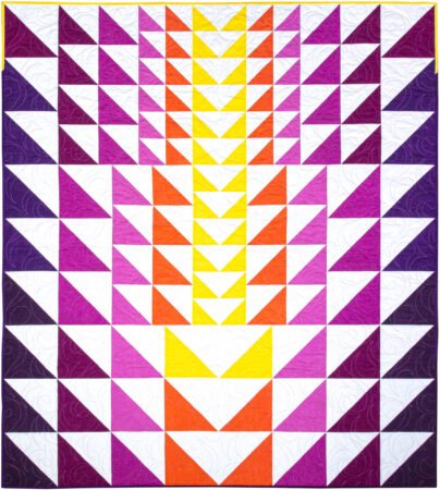 Top US quilting blog and shop, Kate Colleran Designs, shares about new quilts in the new year! Featured quilt is in HST in bright solid yellow, orange, magenta, pink and purples.