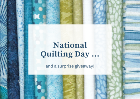 Top US quilting blog and shop, Kate Colleran Designs, shares about National Quilting Day and a surprise fabric giveaway! Image is a line of blue and green fabrics with words over the top