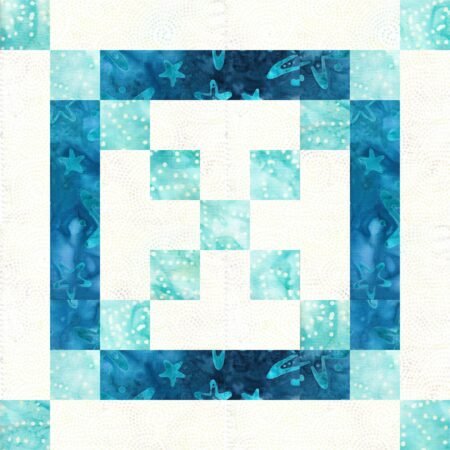 Top US quilting blog and shop, Kate Colleran Designs, shares about her January Quilt Block Remix Sneak Peek #1! Image show is a quilt block made of squares and rectangles in light blue, off white and dark blue batik fabrics.