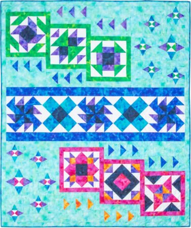 Top US quilting blog and shop, Kate Colleran Designs, shares about her Allure BOM quilt and tips for block 1! Image is a quilt with blocks set in rows with an aqua background and blocks in blues, greens, purples, magenta, orange and white fabrics.