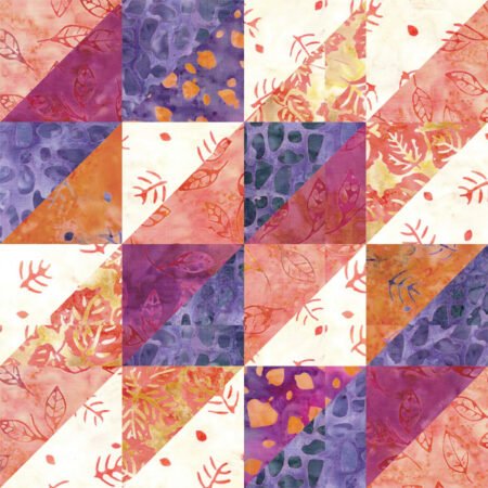 Top US quilting blog and shop, Kate Colleran Designs, shares about her April quilt block remix and sneak peek #1! Image is a quilt block of HST units in orange, purple, magenta and off white batiks.