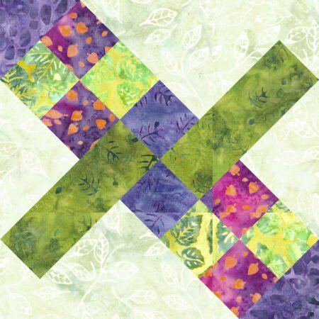 Top US quilting blog and shop, Kate Colleran Designs, shares about her June quilt block remix and reveals her new block! Image is a digital version of a quilt block using squares and rectangles in magenta, purple, and green batiks.