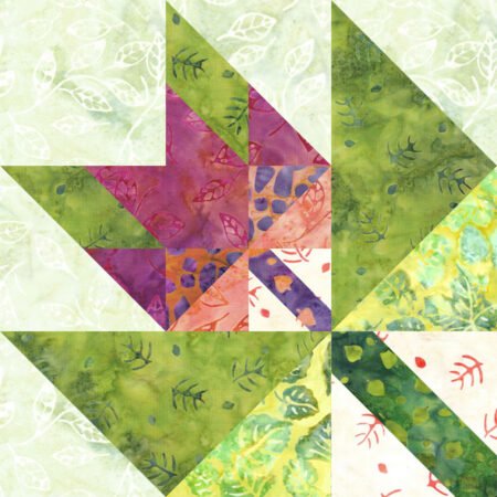 Top US quilting blog and shop, Kate Colleran Designs, shares about her September Block Remix challenge and her new block! Image is of a maple leaf in a maple leaf quilt block made in green, orange pink and purple batiks.