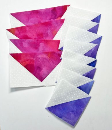 Top US quilting blog and shop, Kate Colleran Designs, shares tips in the Allure BOM Block 7 post. Image is of white and magenta pink flying geese units and white and purple half square triangle units.