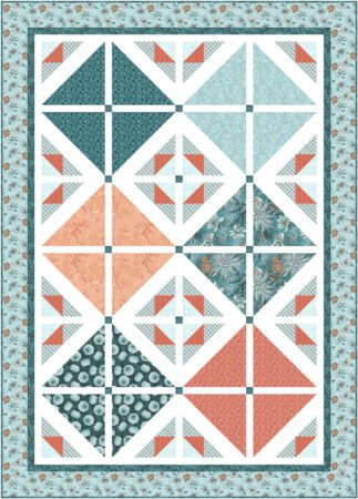Top US quilting blog and shop, Kate Colleran Designs, shares about her new Chalk Hill Blue quilt pattern! Image is a quilt with triangles of orange, and teal in a setting with white sashing and light teal border.