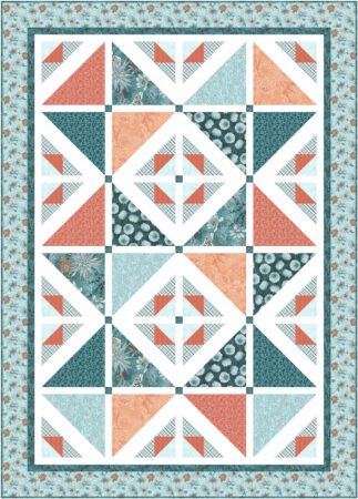 Top US quilting blog and shop, Kate Colleran Designs, shares about her new Chalk Hill Blue quilt pattern! Image is a quilt with triangles of orange, and teal in a setting with white sashing and light teal border.