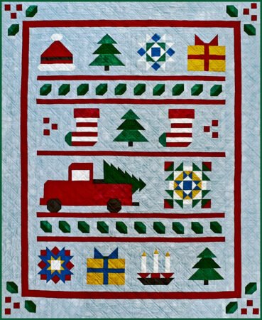 Top US quilting blog and shop, Kate Colleran Designs, shares about the Jingle Bell Pines Block of the Month quilt Block Party. Image is a holiday quilt with a medium blue background and pieced holiday blocks in red, green, white and gold.