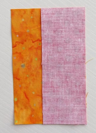 Top US quilting blog and shop, Kate Colleran Designs, shares about Block 4 Gifts Galore in the Jingle Bell Pines BOM Block Party! Image 2 pieces of fabric layered together