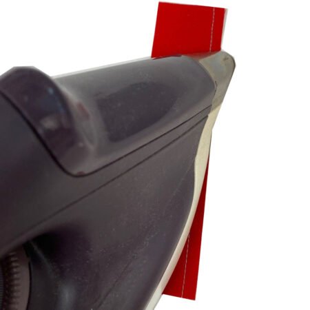 Jingle Bell Pines BOM Block Party Block 5 Jingle Socks! Image is a red and white strips set with the tip of the iron pressing the seam on the front of the strip set.