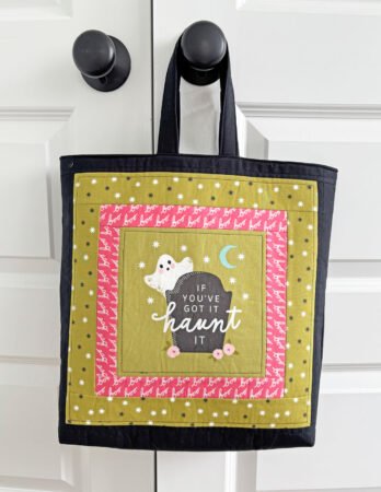 Top US quilting blog and shop, Kate Colleran Designs, shares about new projects using quilt blocks and how to resize. Image is of a green Halloween panel with pink, green and black borders made into a tote bag.