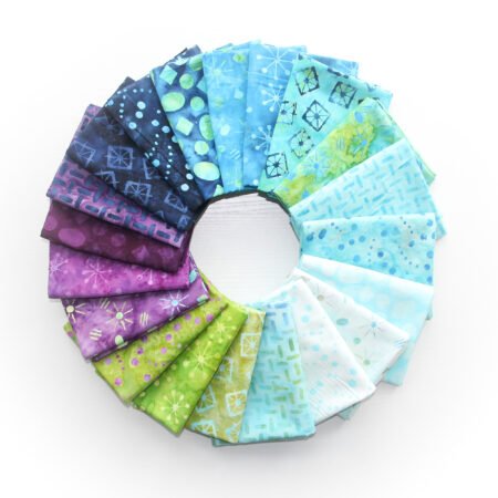 Top US quilting blog and shop, Kate Colleran Designs, shares about her new batik line called Garden Gate and a FQ bundle giveaway! Image is a circle of fabrics in blues, greens and magentas.
