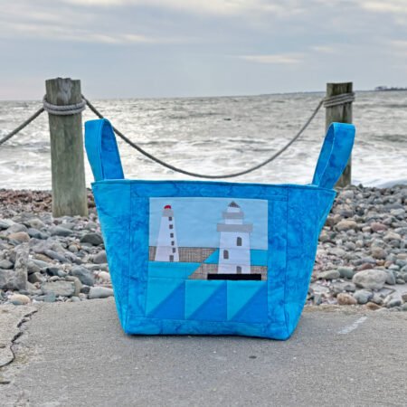 fabric bin in blue fabrics with a lighthouse quilt block