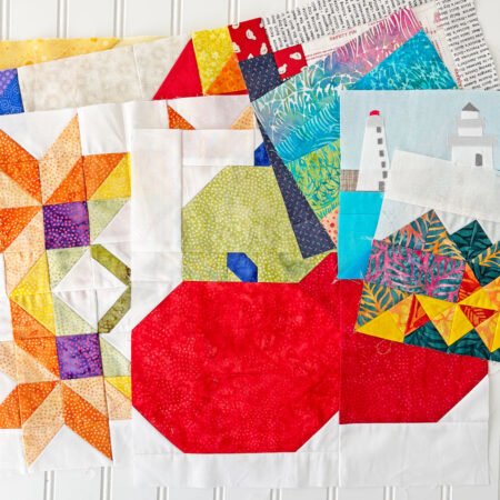 a pile of colorful quilt blocks