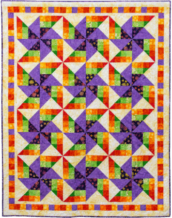 quilt with pinwheel quilt blocks in purple, green, yellow, orange and red batiks with a checkerboard border
