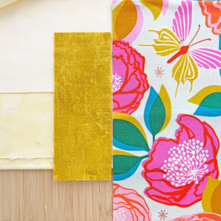 fabrics shown to share the colors of the print border, gold sashing and little yellow sashing square fabric