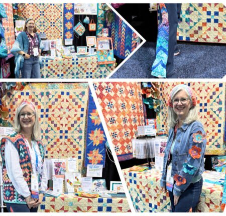 Kate and Alyssa showing off crochet vests and jeans with braid accent in front of color trade show booth.